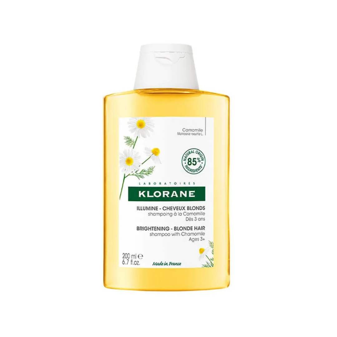 Klorane shampoo bottle with white cap on a white background