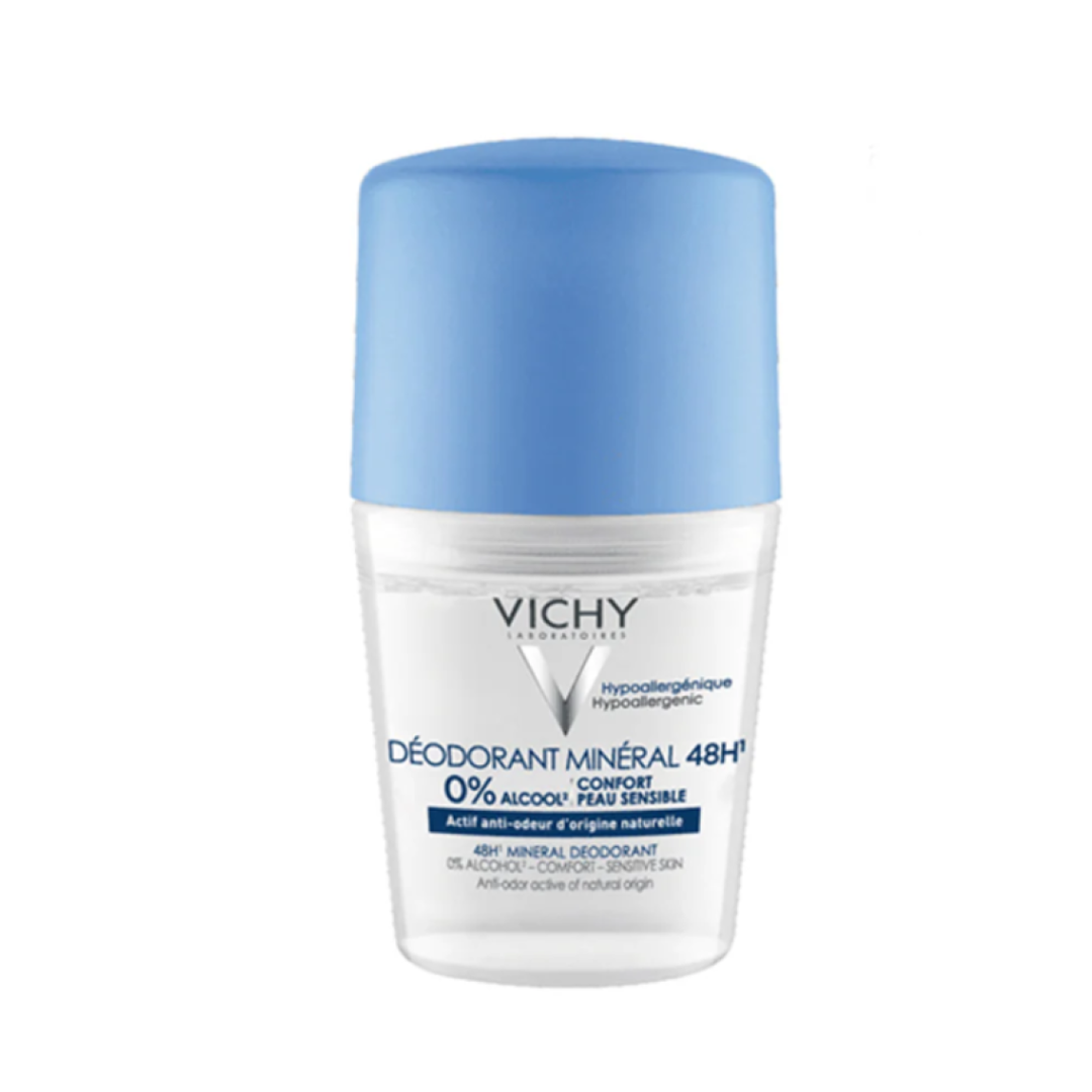 Vichy deodorant bottle with blue cap on a white background