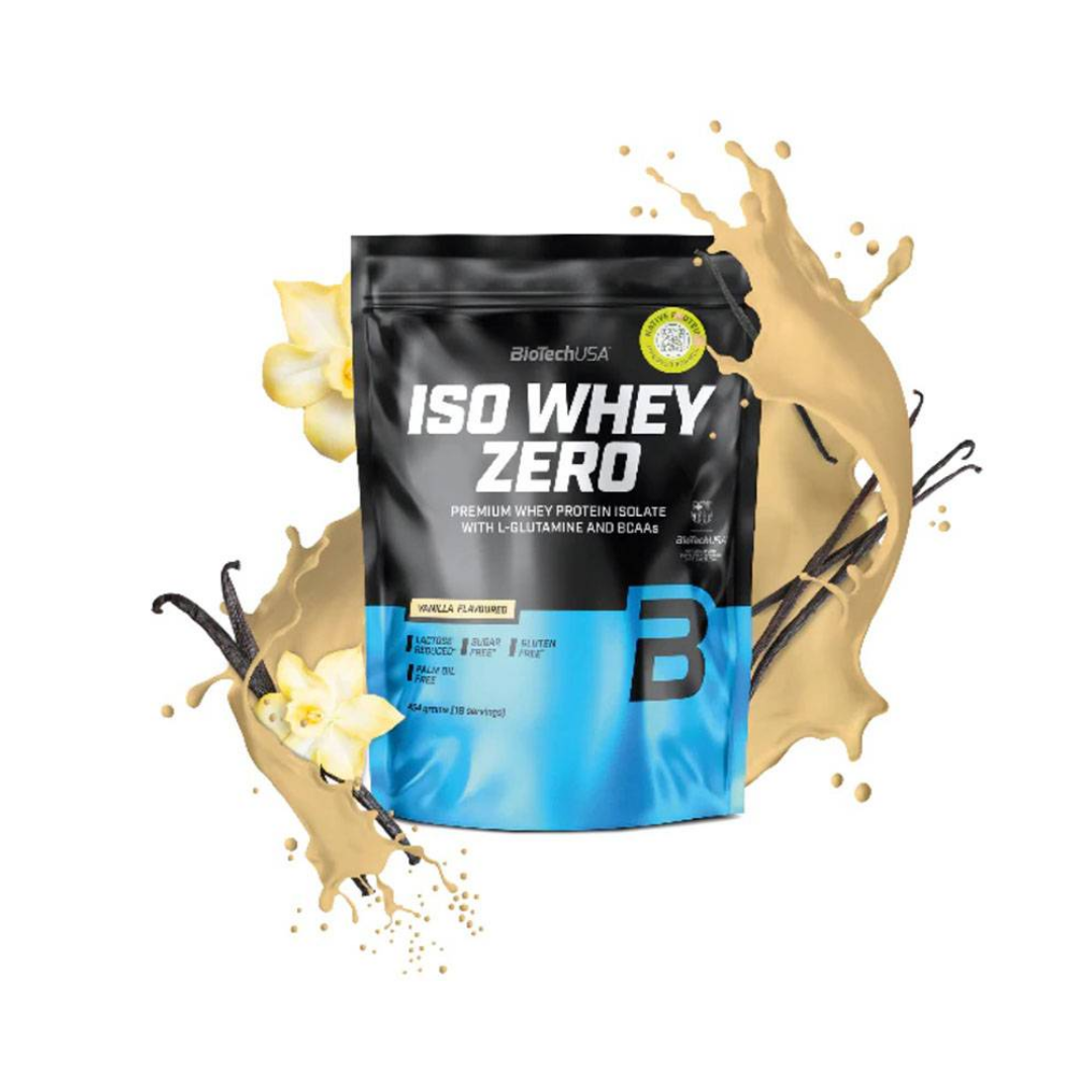 A pouch of Isobell Isotools ISO Whey Zero protein powder in vanilla flavor, styled with a golden vanilla splash, vanilla beans, and white vanilla flowers on a solid white background.